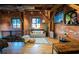 Charming second-floor living room with exposed brick, hardwood floors, and a comfortable seating area, offering a relaxing retreat at 490 Marietta Nw St # 101, Atlanta, GA 30313