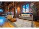 Spacious living room with exposed brick, hardwood floors, and comfortable seating, creating an inviting atmosphere for relaxation at 490 Marietta Nw St # 101, Atlanta, GA 30313