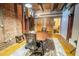Functional office space with exposed brick, sliding barn doors, and a well-lit work area, ideal for productivity and focus at 490 Marietta Nw St # 101, Atlanta, GA 30313