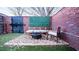 Outdoor patio area with gravel, seating, a brick surround, and a fire pit, for relaxing at 490 Marietta Nw St # 101, Atlanta, GA 30313