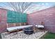 Outdoor patio area with gravel, seating, a brick surround, and a fire pit, for relaxing at 490 Marietta Nw St # 101, Atlanta, GA 30313