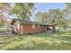 Backyard featuring well-kept grass and a brick exterior at 1189 E East Fayetteville Rd, Riverdale, GA 30296