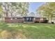 Expansive green backyard with a screened porch, perfect for outdoor entertaining at 1189 E East Fayetteville Rd, Riverdale, GA 30296