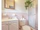 Charming pink bathroom with a shower, toilet, and vanity with storage space at 1189 E East Fayetteville Rd, Riverdale, GA 30296