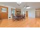 Elegant dining area featuring hardwood floors, a fireplace, and natural light at 1189 E East Fayetteville Rd, Riverdale, GA 30296