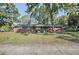 Charming single-story brick home with a well-maintained lawn and mature trees at 1189 E East Fayetteville Rd, Riverdale, GA 30296