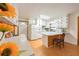 Bright kitchen featuring white cabinets, hardwood flooring, and a breakfast bar with seating at 1189 E East Fayetteville Rd, Riverdale, GA 30296