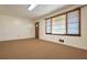 Cozy living room featuring a window and a carpeted floor at 1189 E East Fayetteville Rd, Riverdale, GA 30296