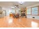 Inviting open-concept living room with hardwood floors and a stone fireplace at 1189 E East Fayetteville Rd, Riverdale, GA 30296