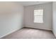 Neutral bedroom with window overlooking backyard and carpet at 3135 Washburn St, Atlanta, GA 30354