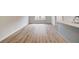 Bright living room with hardwood flooring adjacent to an open-concept kitchen at 3135 Washburn St, Atlanta, GA 30354