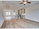 Open floor plan featuring living room and modern kitchen with wood look vinyl flooring at 3135 Washburn St, Atlanta, GA 30354