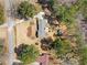 Overhead view of a charming home featuring a spacious yard, mature trees, and convenient outbuilding at 4562 Anderson Livsey Ln, Snellville, GA 30039