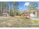 Expansive backyard with a shed, screened deck, open-air pergola, and ample space for recreation at 4562 Anderson Livsey Ln, Snellville, GA 30039