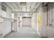 Unfinished basement with painted concrete floors and cinder block walls at 4562 Anderson Livsey Ln, Snellville, GA 30039