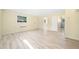 Bright basement with wood-look laminate flooring and neutral paint, ideal for flexible living space at 4562 Anderson Livsey Ln, Snellville, GA 30039