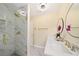 Updated bathroom featuring a glass enclosed shower, dual sinks and marble countertops at 4562 Anderson Livsey Ln, Snellville, GA 30039