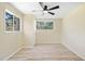 Cozy bedroom with wood-look laminate flooring, ceiling fan, and large windows offering natural light at 4562 Anderson Livsey Ln, Snellville, GA 30039