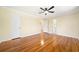Bright bedroom features hardwood floors, a ceiling fan and multiple closets at 4562 Anderson Livsey Ln, Snellville, GA 30039