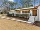 Charming white brick home featuring a neatly landscaped front entrance at 4562 Anderson Livsey Ln, Snellville, GA 30039