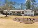 Charming single-story home with white brick and inviting curb appeal at 4562 Anderson Livsey Ln, Snellville, GA 30039