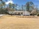 Inviting single-story home with a well-manicured lawn and mature trees at 4562 Anderson Livsey Ln, Snellville, GA 30039