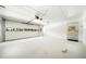 Clean, spacious garage with white walls and ample room for parking and storage at 4562 Anderson Livsey Ln, Snellville, GA 30039