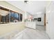 Modern kitchen with marble floors, bright white cabinetry, and backyard view at 4562 Anderson Livsey Ln, Snellville, GA 30039