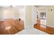 Open-concept living area with hardwood floors and a view of the fireplace at 4562 Anderson Livsey Ln, Snellville, GA 30039