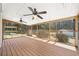 Relaxing screened porch featuring wood decking, ceiling fans and a swing at 4562 Anderson Livsey Ln, Snellville, GA 30039