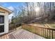 Spacious back deck overlooking a lush, wooded landscape at 5071 Vinings Estates Se Ct, Mableton, GA 30126