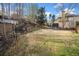 Expansive backyard with a mix of lawn and natural areas, featuring tiered landscaping at 5071 Vinings Estates Se Ct, Mableton, GA 30126