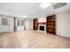 A spacious basement featuring tile flooring and decorative wooden bookshelves at 5071 Vinings Estates Se Ct, Mableton, GA 30126
