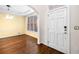 Bright dining room with hardwood floors, yellow walls, and a modern light fixture at 5071 Vinings Estates Se Ct, Mableton, GA 30126