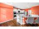 Well-lit kitchen with breakfast bar, stainless appliances, and tile accents at 5071 Vinings Estates Se Ct, Mableton, GA 30126