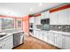 Charming kitchen with stainless appliances, tile backsplash, and ample counter space at 5071 Vinings Estates Se Ct, Mableton, GA 30126