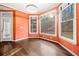 Sun-drenched sun room offering a serene view of the wooded backyard at 5071 Vinings Estates Se Ct, Mableton, GA 30126