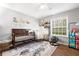 Cozy Bedroom with a crib, rocking chair, and whimsical decor at 106 Brighton Pt, Atlanta, GA 30328