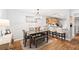 Bright dining area features a table with chairs, a bench, and a view of the kitchen at 106 Brighton Pt, Atlanta, GA 30328