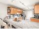 Modern kitchen features a breakfast bar, granite countertops, and stainless steel appliances at 106 Brighton Pt, Atlanta, GA 30328