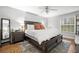 Serene main bedroom with a comfortable bed, natural light, and stylish furnishings at 106 Brighton Pt, Atlanta, GA 30328