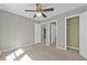 Bedroom with ceiling fan and access to closet and hallways at 1358 Mckinsey Rdg, Loganville, GA 30052