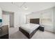 A bedroom with neutral walls, carpet, and a bed frame with windows that allow natural light at 158 Rolling Hills Pl, Canton, GA 30114