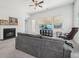 Inviting living room with fireplace, ceiling fan and large window with natural light at 158 Rolling Hills Pl, Canton, GA 30114