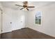 Bright bedroom with hardwood floors, ceiling fan, and freshly painted white walls at 170 Gilreath Nw Rd, Cartersville, GA 30121