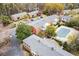 Aerial view of multi-unit complex with parking, pool, mature trees, and balconies at 2345 Henderson Mill Ne Rd # 1, Atlanta, GA 30345