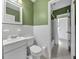 Bright bathroom featuring white tile, classic fixtures, and a convenient shower-tub combination at 2345 Henderson Mill Ne Rd # 1, Atlanta, GA 30345