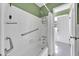 White tiled bath and shower combination at 2345 Henderson Mill Ne Rd # 1, Atlanta, GA 30345