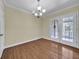 Dining room with hardwood floors, modern lighting fixture, and double doors to the outside at 2345 Henderson Mill Ne Rd # 1, Atlanta, GA 30345