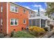 Exterior view of a brick unit showing a balcony, screened porch and mature landscaping at 2345 Henderson Mill Ne Rd # 1, Atlanta, GA 30345